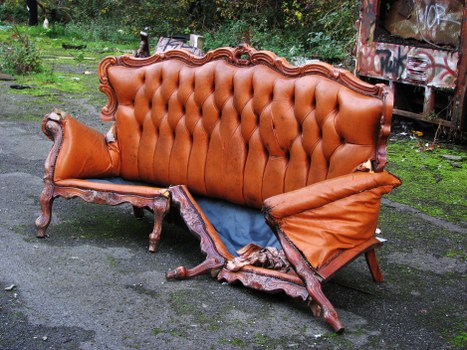 Small skip next to a modern flat in Bayswater